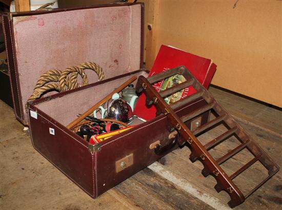 Suitcase of games, carvings, etc